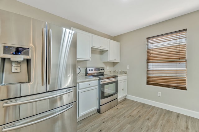 1946 Courtside Dr, Dallas, TX 75051 - kitchen featuring appliances with stainless steel finishes, light wood-type flooring, baseboards, white cabinets, and light stone countertops