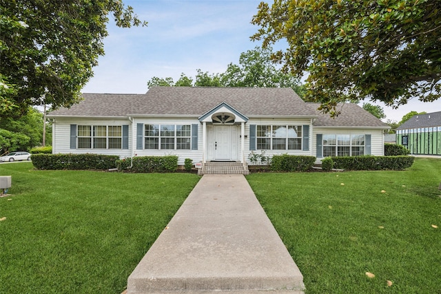 745 Buckner Blvd, Dallas, TX 75218 - view of front of home featuring a front lawn and roof with shingles