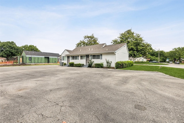 745 Buckner Blvd, Dallas, TX 75218 - single story home featuring a front yard and roof with shingles