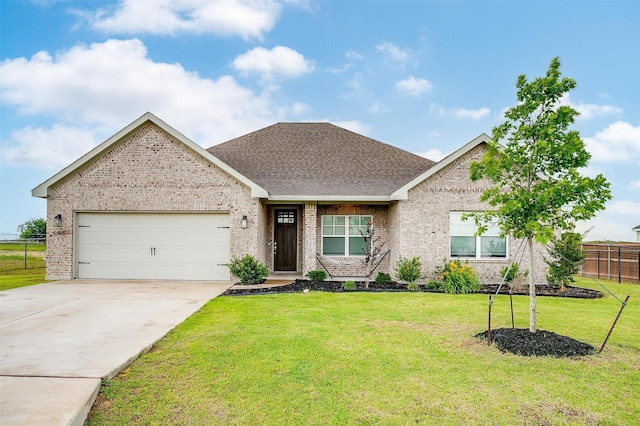 9405 Wildcat Rdg, Godley, TX 76044 - view of front facade with brick siding, a garage, concrete driveway, and roof with shingles