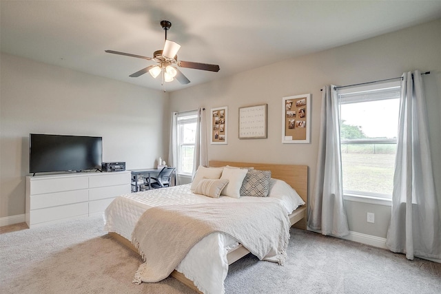 9405 Wildcat Rdg, Godley, TX 76044 - carpeted bedroom featuring multiple windows, baseboards, and a ceiling fan