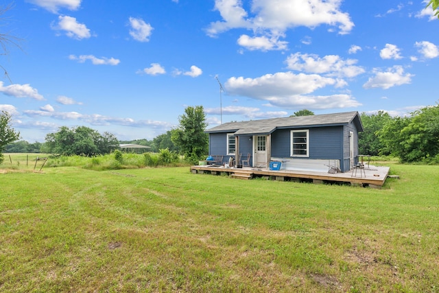 2227 Fm 2815 S, Bonham, TX 75418 - rear view of house featuring a deck and a lawn