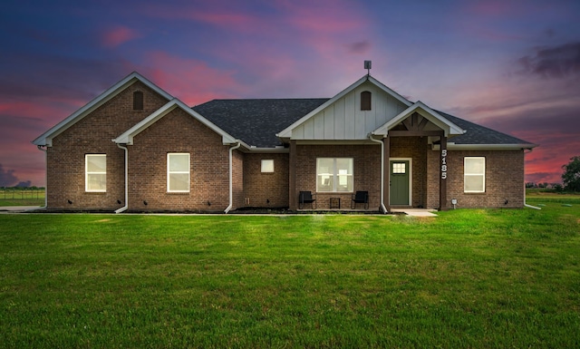 5185 Fox Trot Ln, Caddo Mills, TX 75135 - view of front of property featuring a lawn, brick siding, and board and batten siding