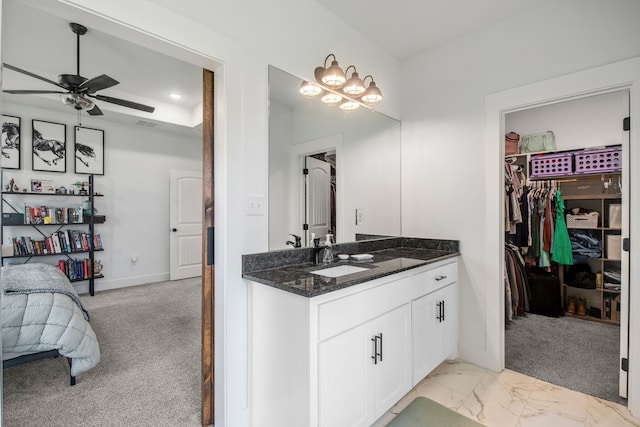 5185 Fox Trot Ln, Caddo Mills, TX 75135 - bathroom featuring vanity, ceiling fan, a walk in closet, marble look tile flooring, and a chandelier