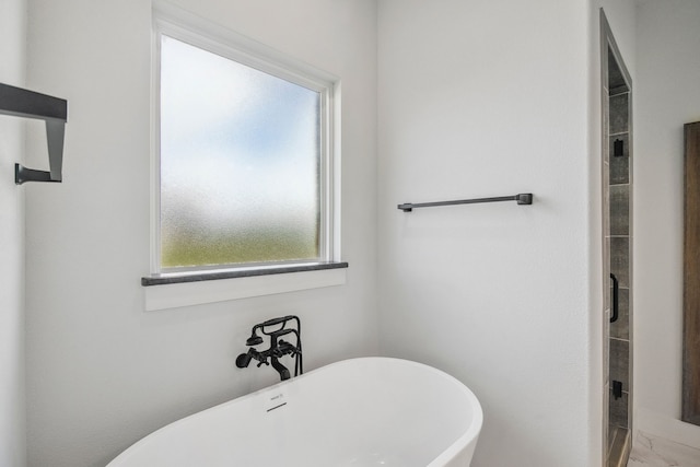 5185 Fox Trot Ln, Caddo Mills, TX 75135 - bathroom featuring a freestanding tub, a stall shower, and marble finish floors