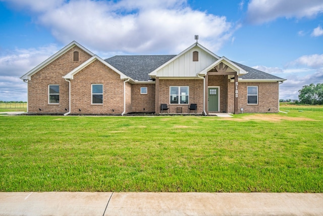 5185 Fox Trot Ln, Caddo Mills, TX 75135 - view of front of home featuring a front lawn, brick siding, and board and batten siding