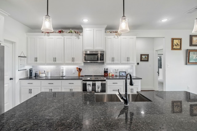 5185 Fox Trot Ln, Caddo Mills, TX 75135 - kitchen with appliances with stainless steel finishes, tasteful backsplash, white cabinetry, and recessed lighting