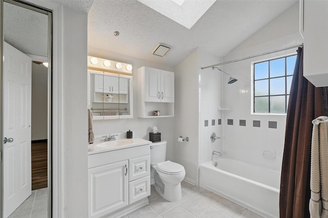 5590 Spring Valley Rd Unit C208, Dallas, TX 75254 - full bath featuring a skylight, shower / tub combo with curtain, vanity, toilet, and tile patterned floors