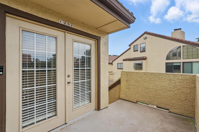 5590 Spring Valley Rd Unit C208, Dallas, TX 75254 - view of patio with a balcony and french doors