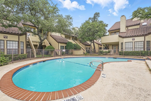 5590 Spring Valley Rd Unit C208, Dallas, TX 75254 - community pool featuring a residential view