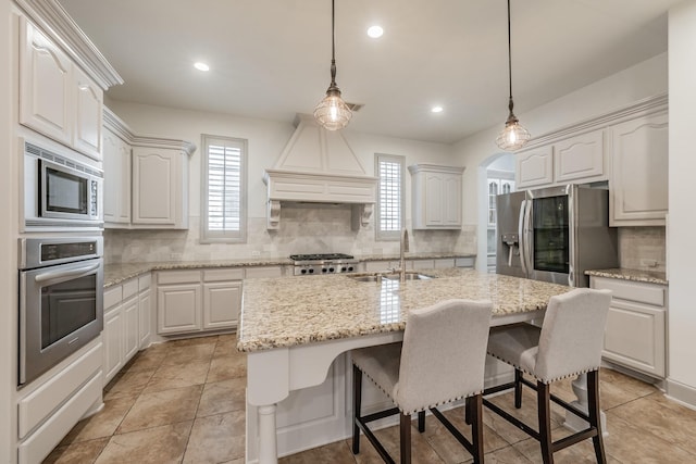 2117 Torin St, Lewisville, TX 75056 - kitchen featuring stainless steel appliances, a sink, decorative backsplash, plenty of natural light, and recessed lighting