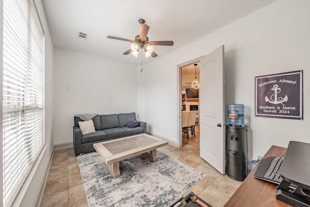 2117 Torin St, Lewisville, TX 75056 - living room with ceiling fan and baseboards
