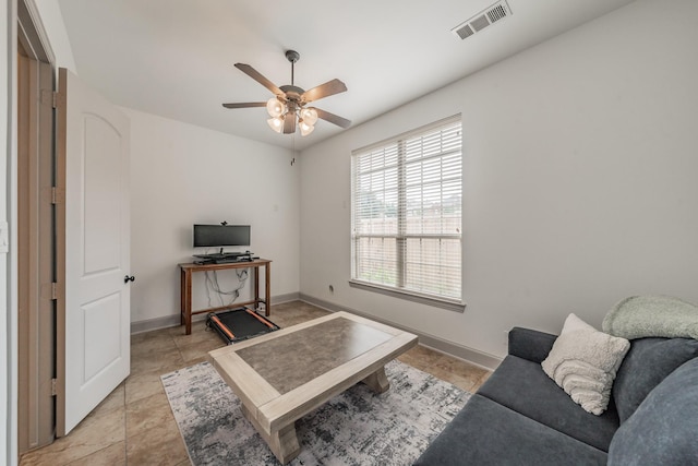2117 Torin St, Lewisville, TX 75056 - living room featuring a ceiling fan and baseboards
