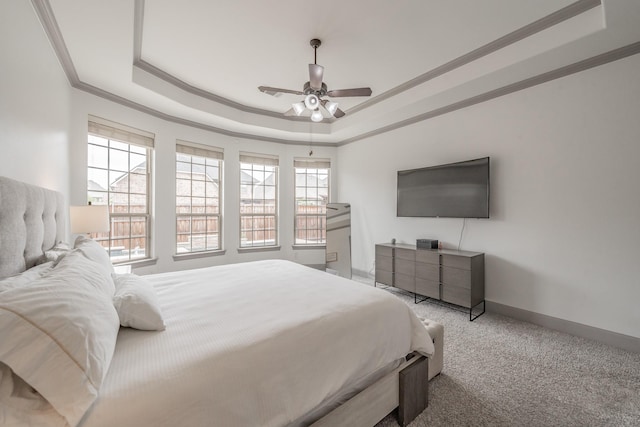 2117 Torin St, Lewisville, TX 75056 - carpeted bedroom with a tray ceiling, ornamental molding, baseboards, and a ceiling fan