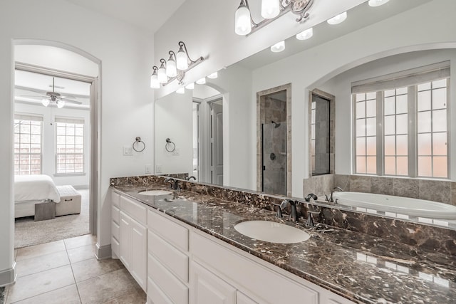 2117 Torin St, Lewisville, TX 75056 - bathroom with a stall shower, double vanity, tile patterned floors, a bath, and ceiling fan