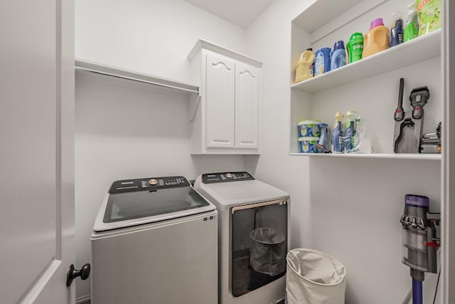 2117 Torin St, Lewisville, TX 75056 - laundry room featuring washer and clothes dryer and cabinet space