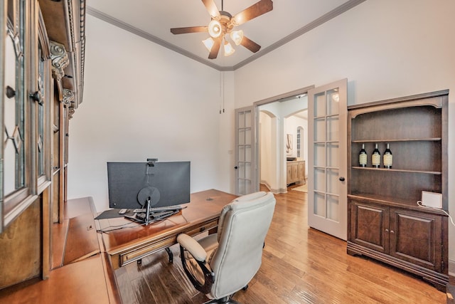 2117 Torin St, Lewisville, TX 75056 - home office featuring ornamental molding, french doors, a ceiling fan, light wood-style flooring, and arched walkways