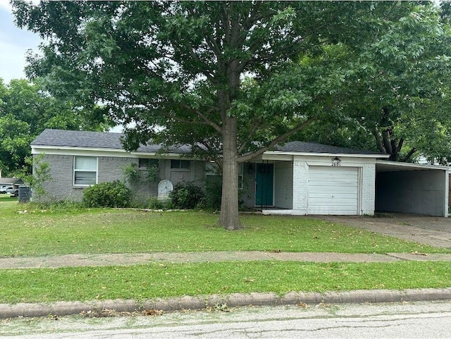 2601 Woodlawn Dr, Ennis, TX 75119 - view of front of house featuring brick siding, a front lawn, driveway, a carport, and a garage