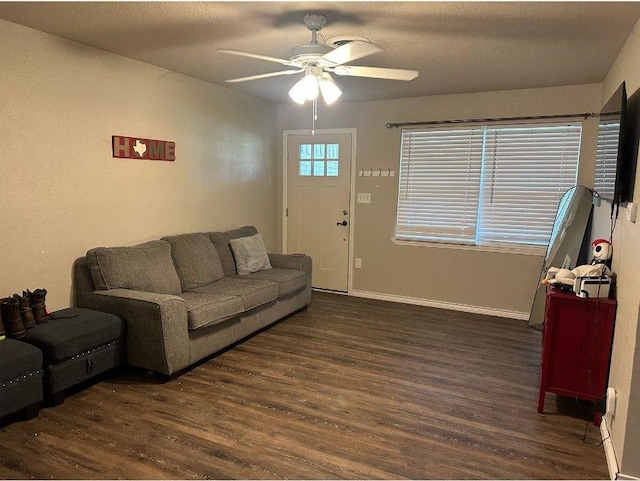 2601 Woodlawn Dr, Ennis, TX 75119 - living room with wood finished floors, a ceiling fan, and baseboards