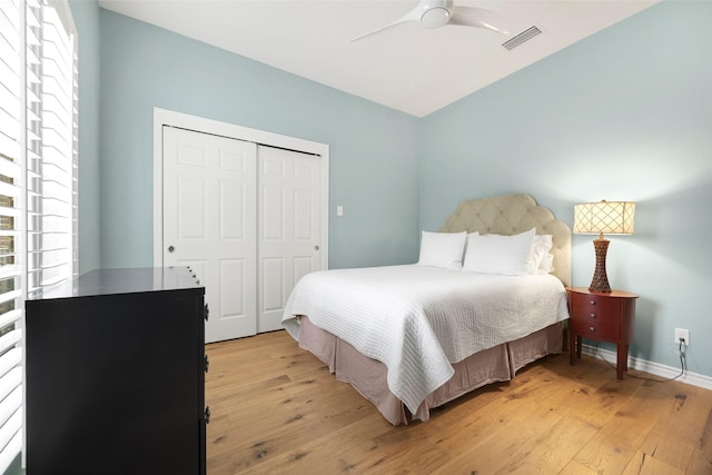15810 Ranchita Dr, Dallas, TX 75248 - bedroom featuring multiple windows, light wood-style floors, and a closet