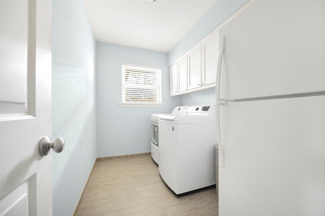 15810 Ranchita Dr, Dallas, TX 75248 - laundry area with washing machine and dryer, baseboards, and cabinet space
