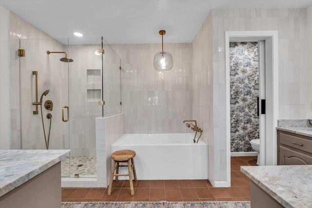 13734 Riverview Dr, Woodway, TX 76712 - bathroom featuring vanity, a tub to relax in, a shower stall, tile patterned floors, and toilet