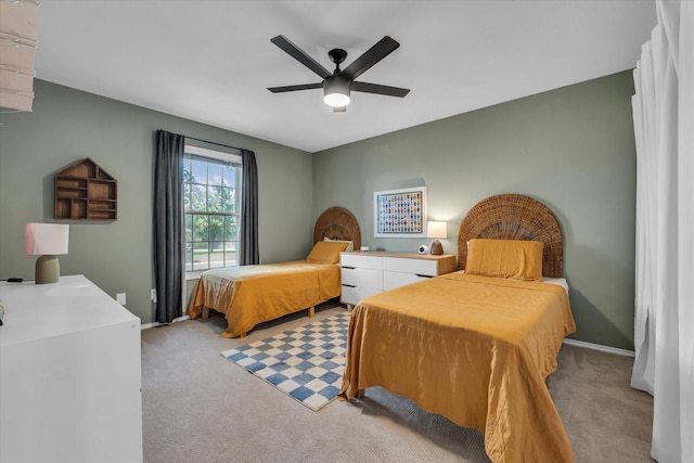 13734 Riverview Dr, Woodway, TX 76712 - bedroom featuring light colored carpet, a ceiling fan, and baseboards