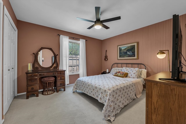 13734 Riverview Dr, Woodway, TX 76712 - bedroom featuring a closet, light carpet, ceiling fan, and baseboards