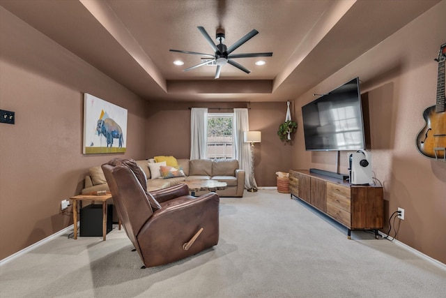 13734 Riverview Dr, Woodway, TX 76712 - living room featuring ceiling fan, a raised ceiling, light colored carpet, baseboards, and cooling unit
