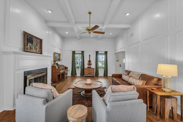 13734 Riverview Dr, Woodway, TX 76712 - living area with a decorative wall, ceiling fan, wood finished floors, a glass covered fireplace, and coffered ceiling