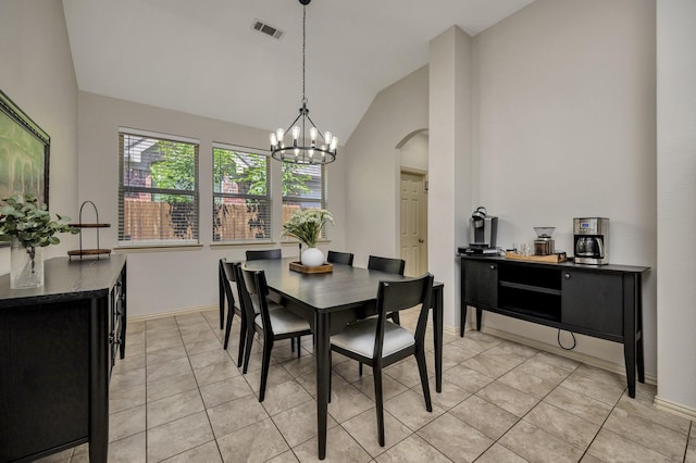 3532 Gallant Trl, Fort Worth, TX 76244 - dining area featuring vaulted ceiling, arched walkways, a chandelier, light tile patterned floors, and baseboards