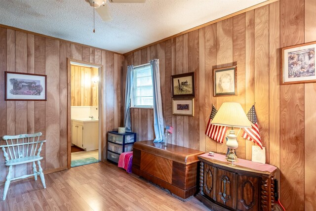 1361 Shady Ln, Canton, TX 75103 - office space featuring ceiling fan, wood finished floors, a textured ceiling, wooden walls, and a sink