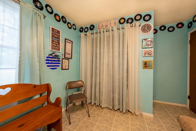 1361 Shady Ln, Canton, TX 75103 - sitting room featuring a textured ceiling and baseboards