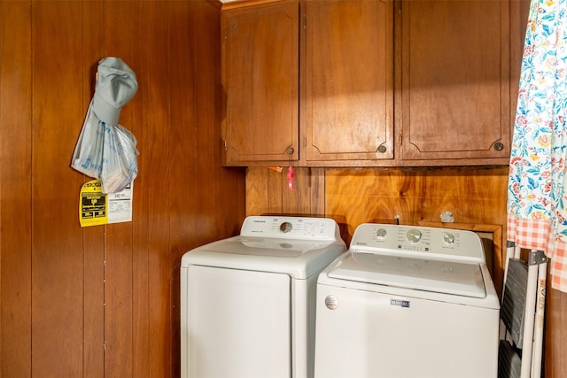 1361 Shady Ln, Canton, TX 75103 - laundry room with washer and dryer, cabinet space, and wooden walls