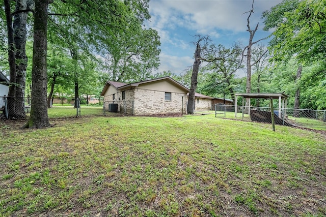 1361 Shady Ln, Canton, TX 75103 - view of yard with central AC and a carport