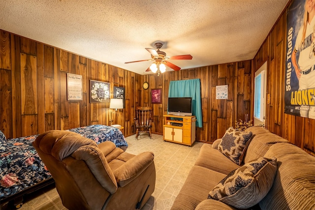 1361 Shady Ln, Canton, TX 75103 - living area with wooden walls, a ceiling fan, and a textured ceiling