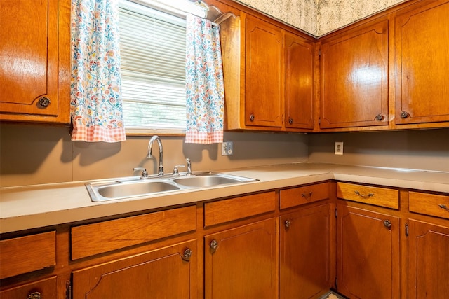 1361 Shady Ln, Canton, TX 75103 - kitchen with a sink, light countertops, and brown cabinetry