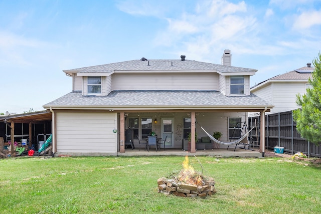2701 Peach Dr, Little Elm, TX 75068 - rear view of house featuring an outdoor fire pit, a patio area, a chimney, and roof with shingles