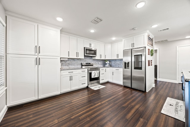 2701 Peach Dr, Little Elm, TX 75068 - kitchen featuring stainless steel appliances, dark wood finished floors, white cabinetry, light stone countertops, and tasteful backsplash