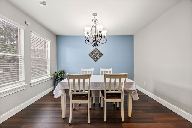 2701 Peach Dr, Little Elm, TX 75068 - dining area featuring a chandelier, baseboards, and wood finished floors