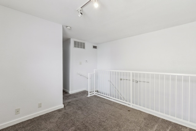 4777 Cedar Springs Rd Unit 6N, Dallas, TX 75219 - carpeted spare room with track lighting and baseboards