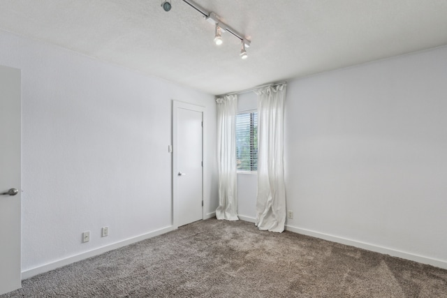 4777 Cedar Springs Rd Unit 6N, Dallas, TX 75219 - spare room featuring carpet floors and baseboards