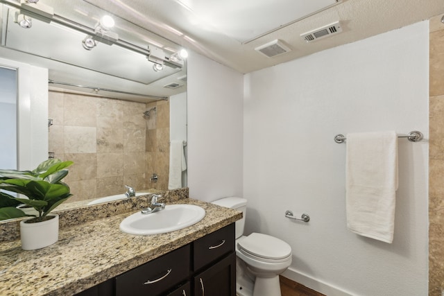 4777 Cedar Springs Rd Unit 6N, Dallas, TX 75219 - full bath featuring vanity, toilet, and a tile shower