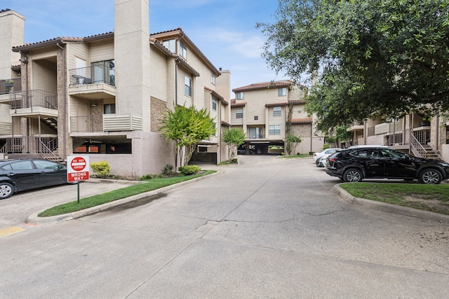 4777 Cedar Springs Rd Unit 6N, Dallas, TX 75219 - view of road with curbs, traffic signs, and a residential view