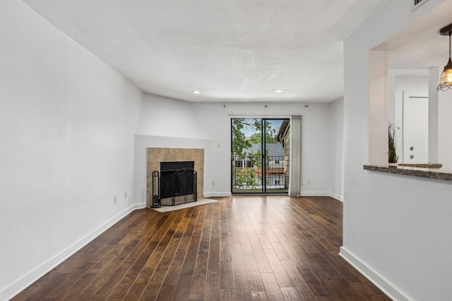 4777 Cedar Springs Rd Unit 6N, Dallas, TX 75219 - unfurnished living room with dark wood finished floors, baseboards, and recessed lighting