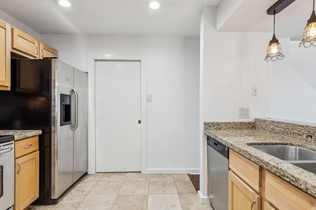 4777 Cedar Springs Rd Unit 6N, Dallas, TX 75219 - kitchen with appliances with stainless steel finishes, recessed lighting, light brown cabinetry, light stone countertops, and decorative light fixtures