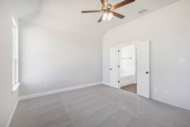 1005 Springfield Dr, Springtown, TX 76082 - unfurnished bedroom featuring carpet, lofted ceiling, a ceiling fan, ensuite bathroom, and baseboards