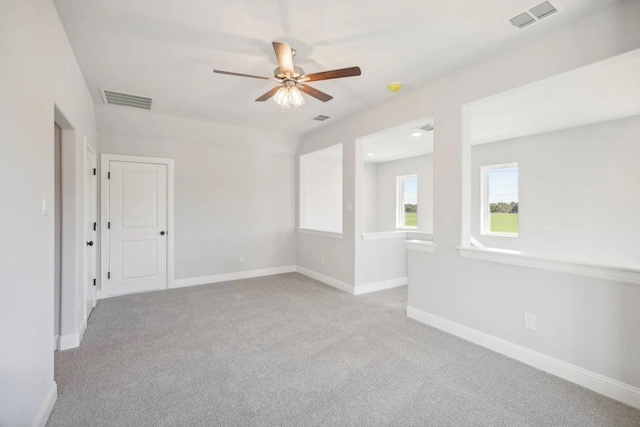 1005 Springfield Dr, Springtown, TX 76082 - spare room with carpet floors, ceiling fan, and baseboards
