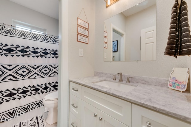 15393 Armstrong Rd, Terrell, TX 75160 - bathroom with vanity, toilet, and a shower with shower curtain