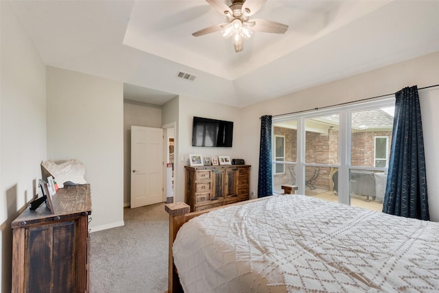 15393 Armstrong Rd, Terrell, TX 75160 - carpeted bedroom featuring a raised ceiling, baseboards, and a ceiling fan